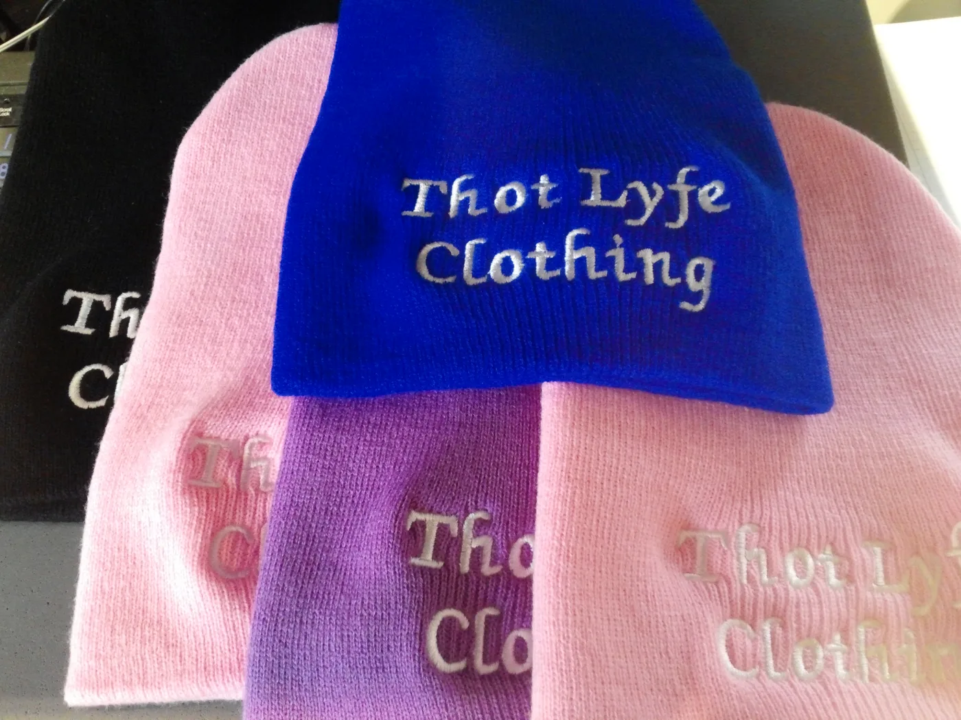Embroidered beanies with a clothing brand logo